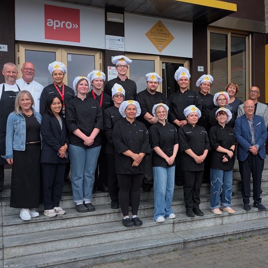 Group photo outside the culinary school in Italy after completing the certificate program.