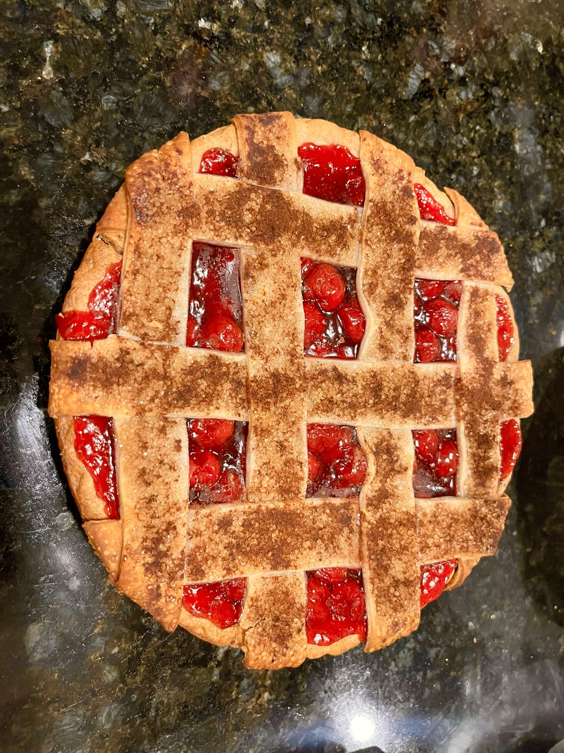 Cherry pie with handwoven lattice crust and cinnamon sugar