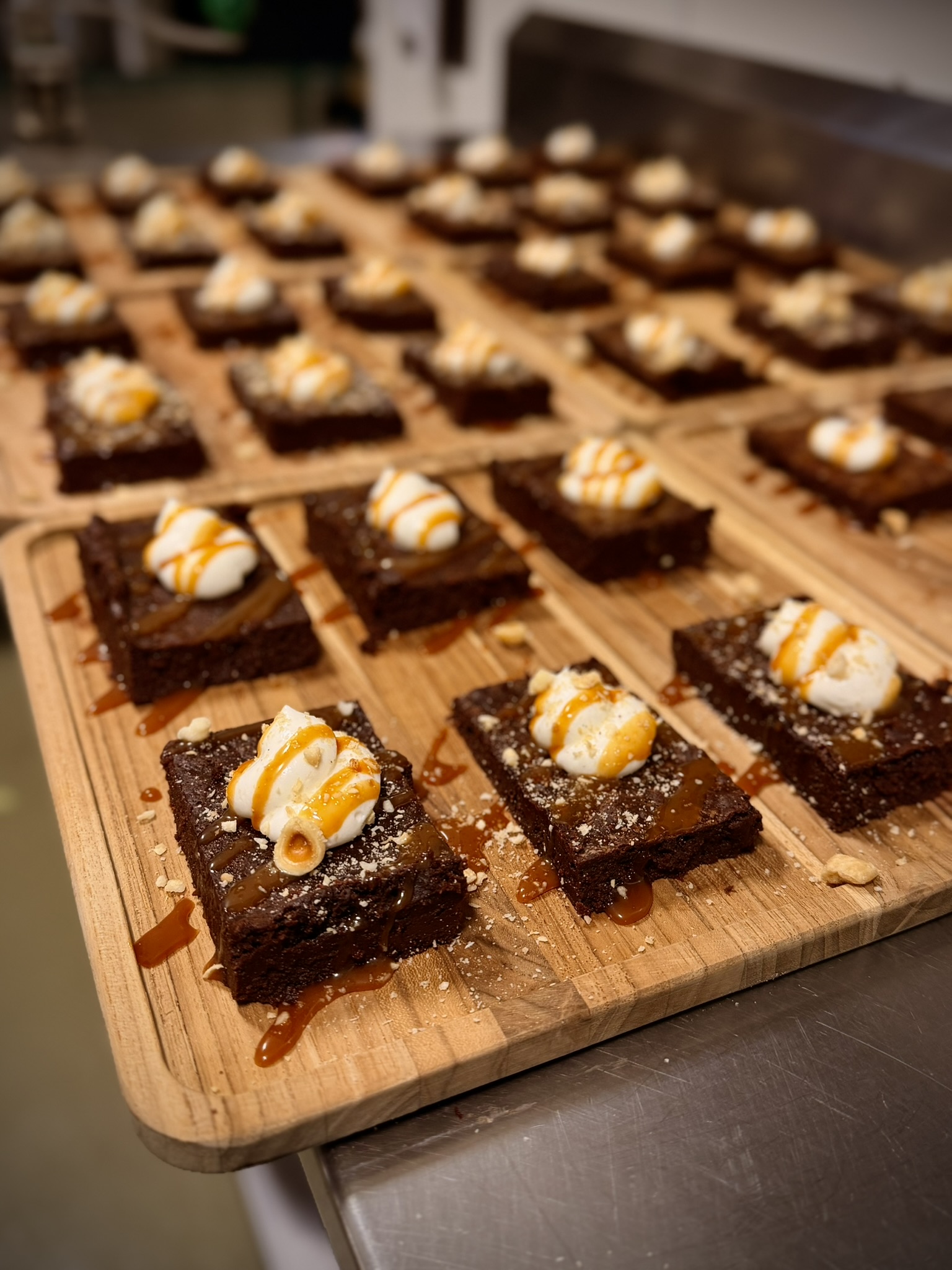 Chocolate torte with whipped cream, toasted milk jam, and hazelnuts